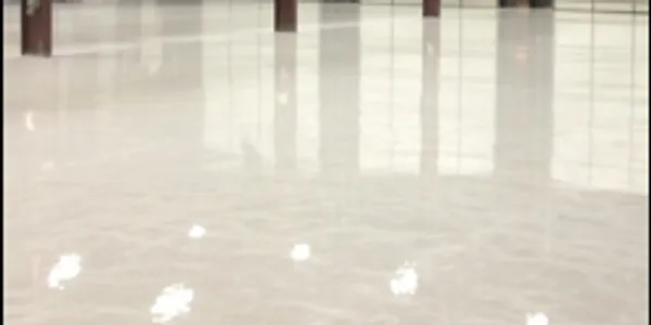 A white floor with shiny floors and reflections.