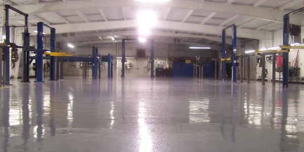 A large warehouse with many blue and white equipment.